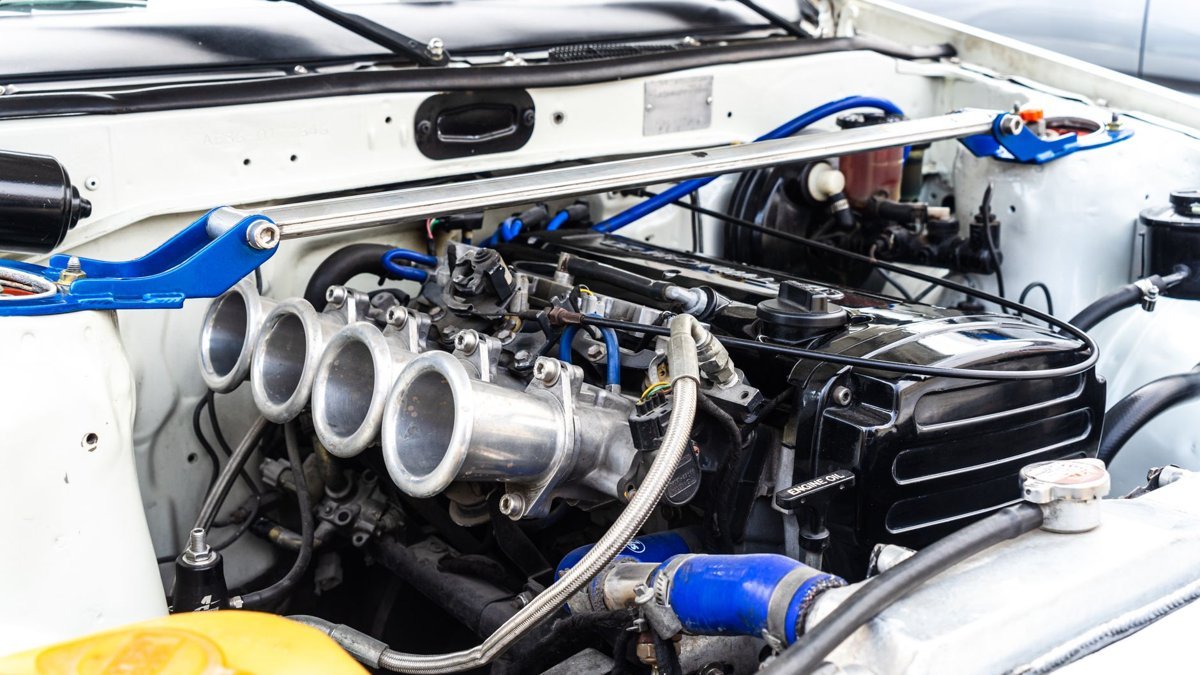 Detailed view of a modified car engine with visible components.